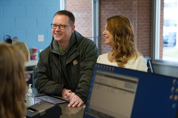 Honor Members talking to a teller