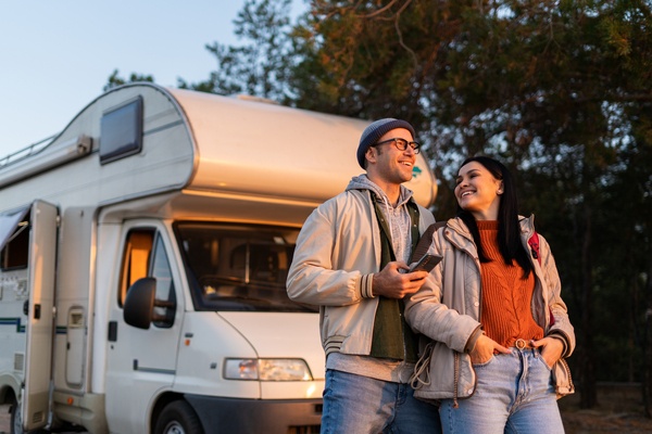 couple in front of a motorhome