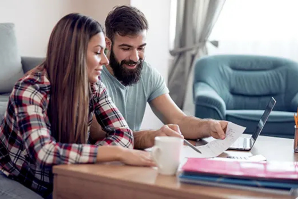 man and women looking over finances