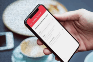 smartphone in a hand with loanpay xpress showing on the screen | Honor Credit Union
