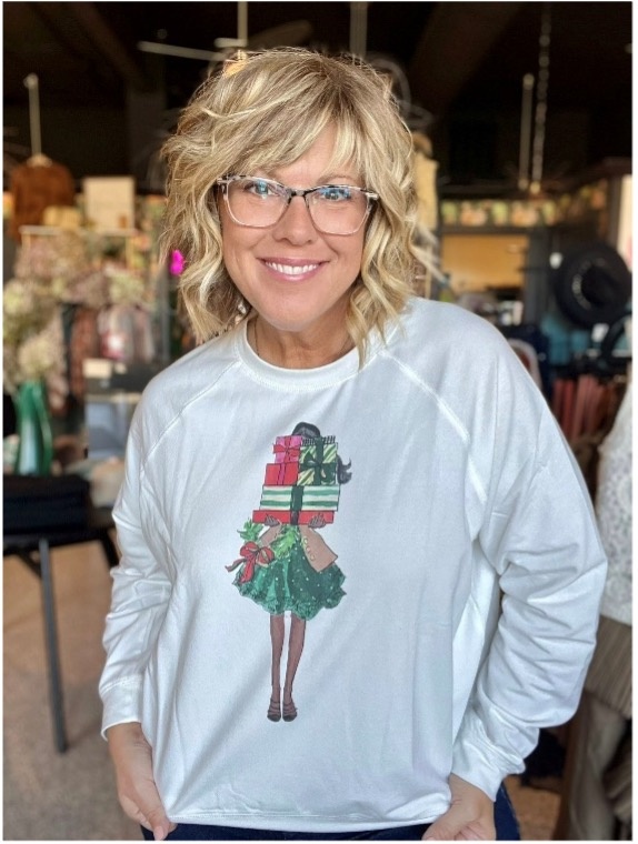 women in festive holiday shirt