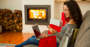 women holiday shopping at home on her laptop | Honor Credit Union