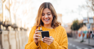 women on looking at her cell phone | Honor Credit Union