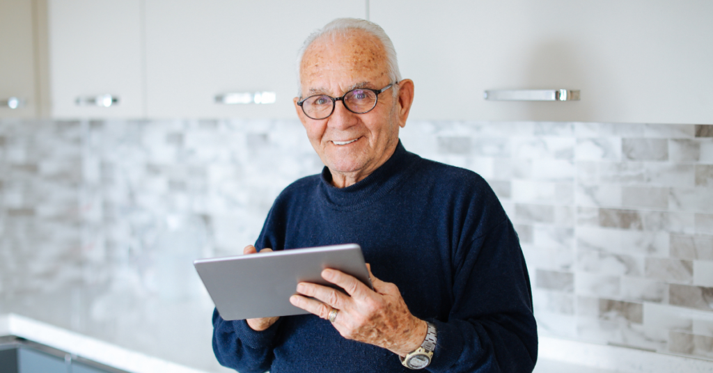 senior man on ipad | Honor Credit Union