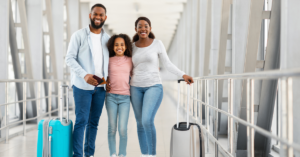 family at the airport with their luggage | Honor Credit Union