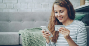 women looking at phone | Honor Credit Union