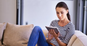 women on her ipad | Honor Credit Union