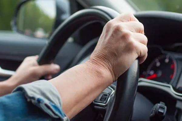 hands on a steering wheel