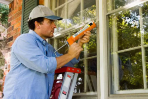 man fixing a window | Honor Credit Union