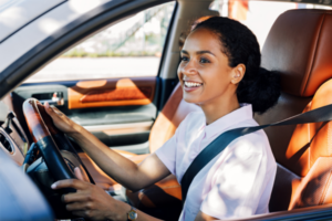 Young adult women driving a car. | Honor Credit Union
