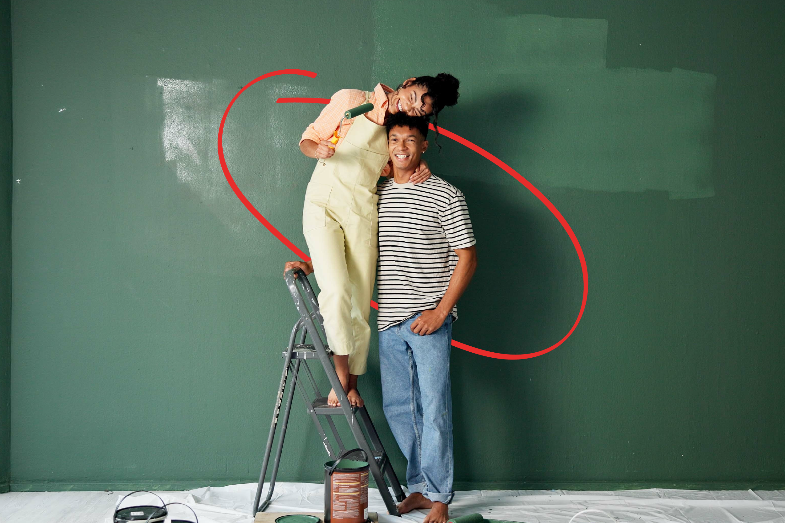 couple painting a room in their new home