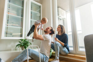 couple with their baby in their home | Honor Credit Union