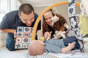 couple playing with baby | Honor Credit Union