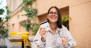 women holding credit card | Honor Credit Union