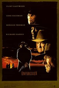Unforgiven movie poster featuring Clint Eastwood, Gene Hackman, Morgan Freeman, and Richard Harris; a gunslinger in a hat facing a desert sunset with four silhouettes on the horizon. | Honor Credit Union