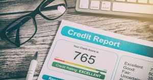 learn what credit is and why you need it learn what credit is and why you need it; glasses and a pen sitting on a table next to a printed out credit report