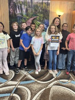 teacher awards winner April Denisiuk of Calhoun Christian School with her class