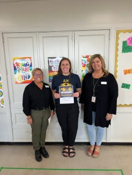 teacher awards winner Chelsea Reichel Battle Creek Public Schools with Honor team members: Melissa Hill and Chelsea Reichel
